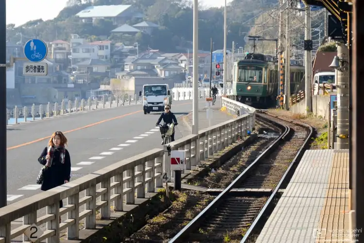 An Enoden (Enoshima Electric Railway) Train is approaching Kamakurakokomae Station in Kanagawa Prefecture. Sections of the line run close to the Shonan Coast.