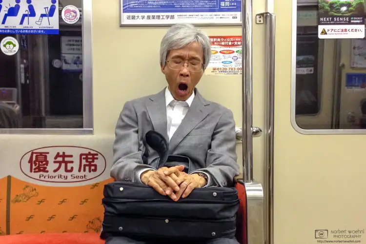 Looks like it has been an exhausting day for this gentleman. Photo taken on the Kūkō Subway Line in Fukuoka, Japan.
