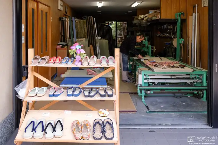 A tatami maker in the Fushimi area of Kyoto, Japan, is displaying a variety of tatami sandals for sale.