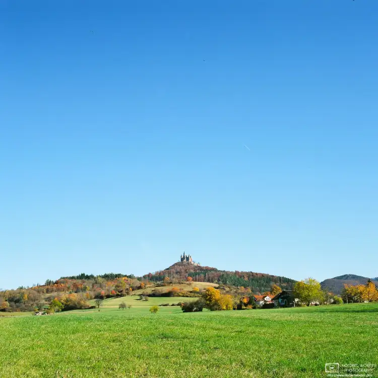An autumnal scene around Hohenzollern Castle in Southwestern Germany, the ancestral seat of the Hohenzollern family.