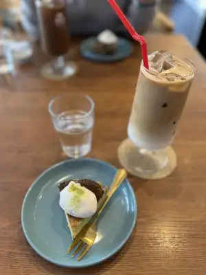 Dessert at Little Bean Works, a cafe in the Itabashi Ward of Tokyo, Japan. Matcha cheesecake and iced caffe latte.