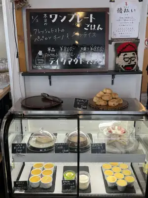 Daily lunch menu board and choice of desserts at Little Bean Works, a cafe in the Itabashi Ward of Tokyo, Japan.