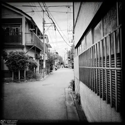 Monochrome photo of a quiet backstreet scene in the Itabashi Ward of Tokyo, Japan.