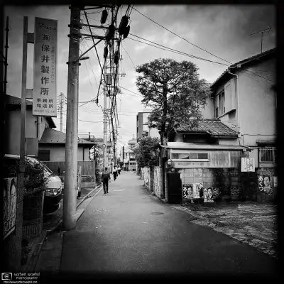 Monochrome photo of a quiet backstreet scene in the Itabashi Ward of Tokyo, Japan.