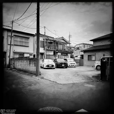 Monochrome photo of a quiet backstreet scene in the Itabashi Ward of Tokyo, Japan.