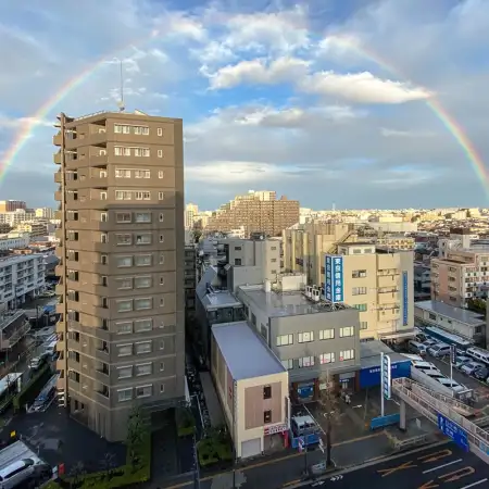 Towards the end of a rain-filled day, a rainbow rises over the eastern part of Itabashi ward in Tokyo, Japan.