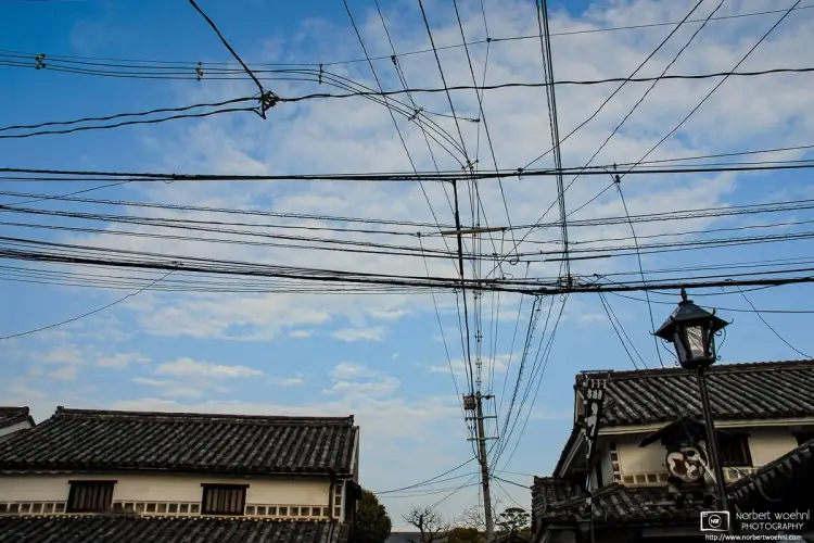 Looking up in the historic Bikan district of Kurashiki in Okayama Prefecture, Japan, I noticed this rather elaborate mesh of electric cables and wires.