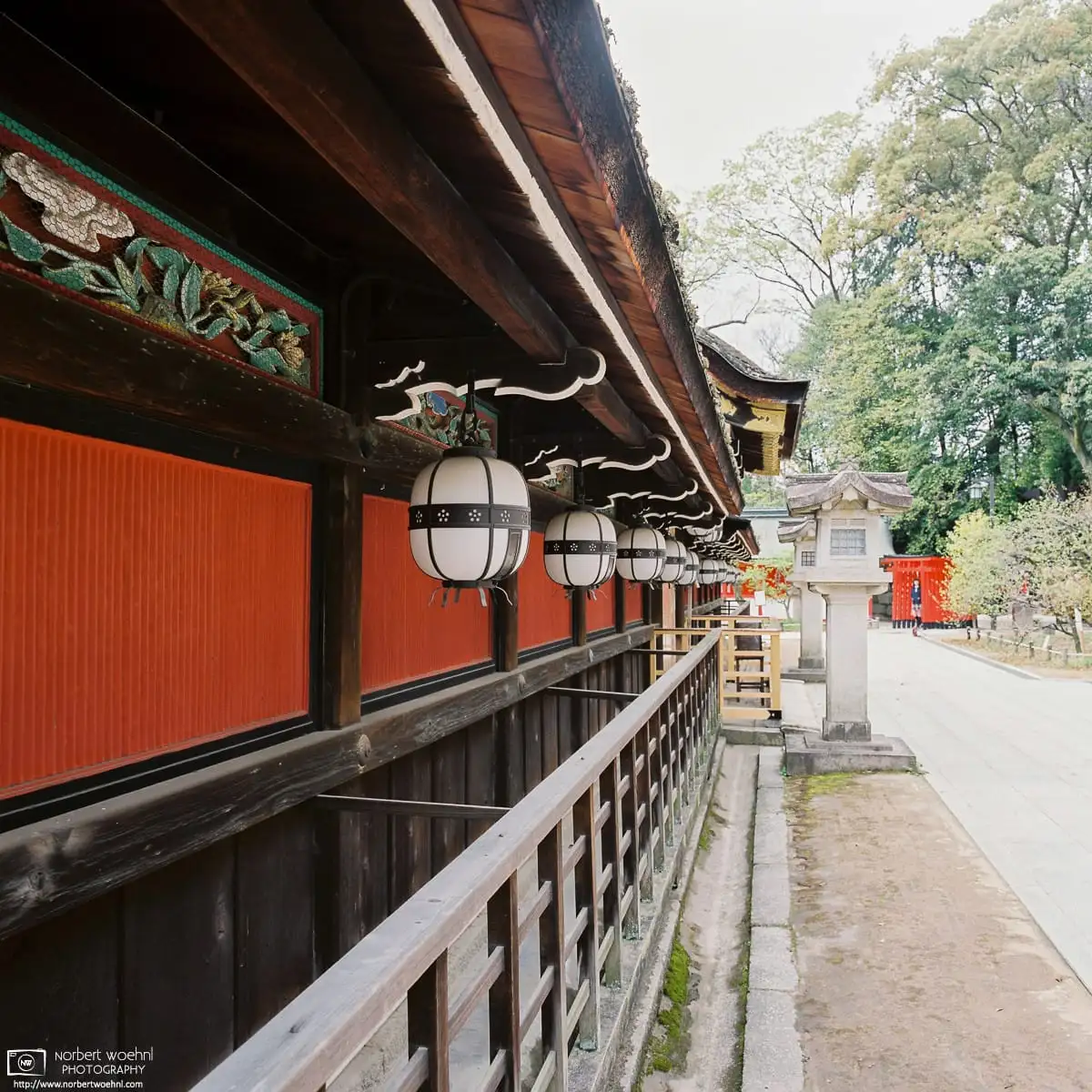 A perspective shot along the decorative details of the Honden, the Main Hall at Kitano Tenmangū Shrine in Kyoto, Japan.