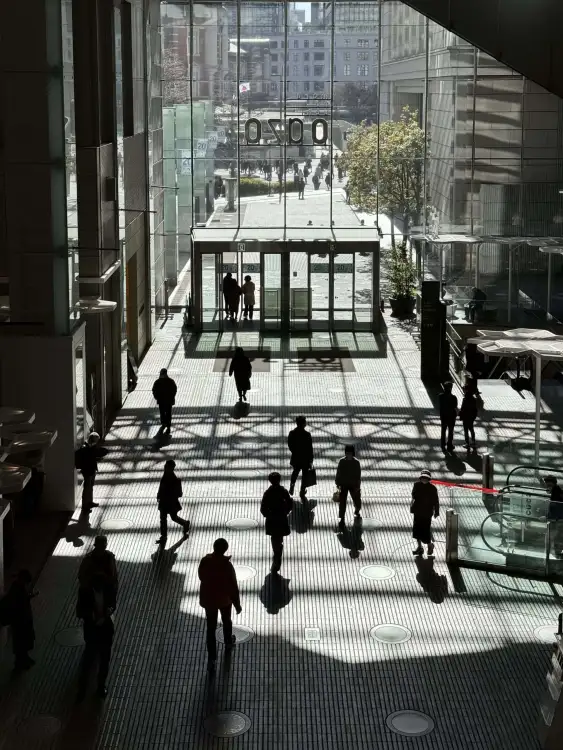 The mid-day sun is doing some artistic work on the concourse of the Marunouchi Oazo Building in Tokyo, Japan.