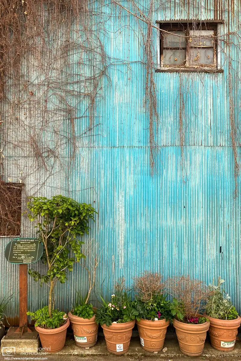 A pastel-colored textured wall in the Okusawa area of Setagaya Ward in Tokyo, Japan.