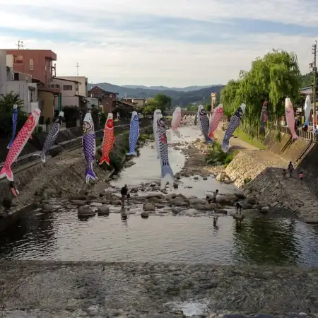 Koinobori (carp-shaped windsocks) are hung across the Miyagawa River in the city of Takayama, Gifu Prefecture, Japan.