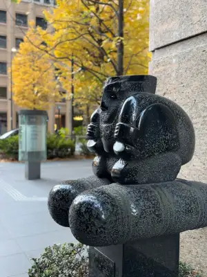 A winter morning street scene from the Ōtemachi business district in Tokyo, Japan. This is a close-up of a sculpture outside a bank.