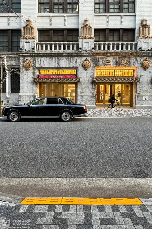 A Toyota Century is parked in front of the ornate side entrance to Mitsukoshi Department Store in Nihonbashi, Tokyo, Japan.