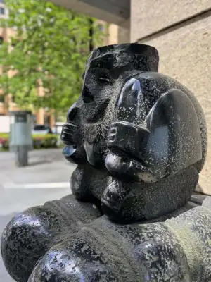Statue outside a bank in Marunouchi, Tokyo. Quite a few passersby touch it in hopes of obtaining financial luck.