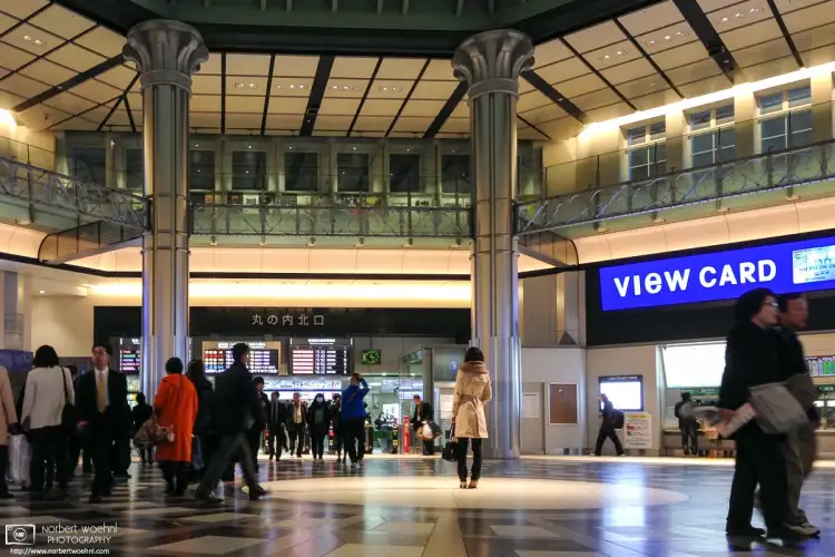 A woman is waiting underneath the northern rotunda of the old Tokyo Station building in Marunouchi, Tokyo, Japan.