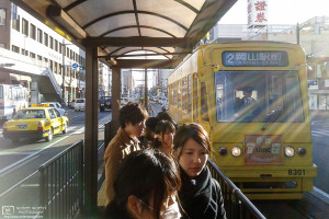 Streetcar arriving at Yubinkyokumae Station, Okayama, Japan Photo