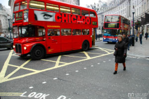At Regent Street in London, England, a double decker bus is decorated with an eye-catching advertisement.