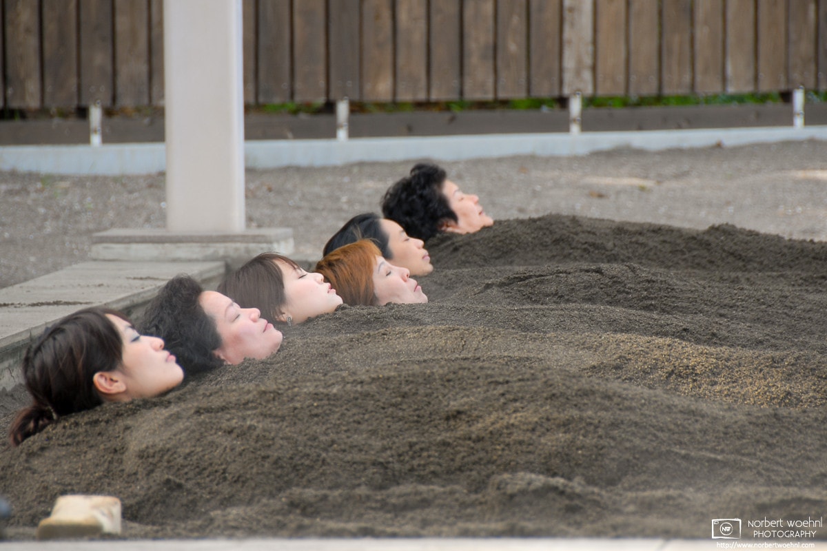 Customers are relaxing while taking a sand bath in Beppu, Oita Prefecture, Japan.