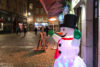 A cheerful snowman figure decorating a storefront in Vieux Lyon, the old Renaissance district of Lyon, France.