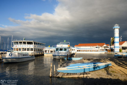 Magnificent light on a stormy afternoon at this boat harbor in Mörbisch on Lake Neusiedl, Burgenland, Austria.