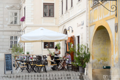 Folks enjoying a nice early-summer afternoon at a street café in the small town of Rust, Burgenland, Austria.