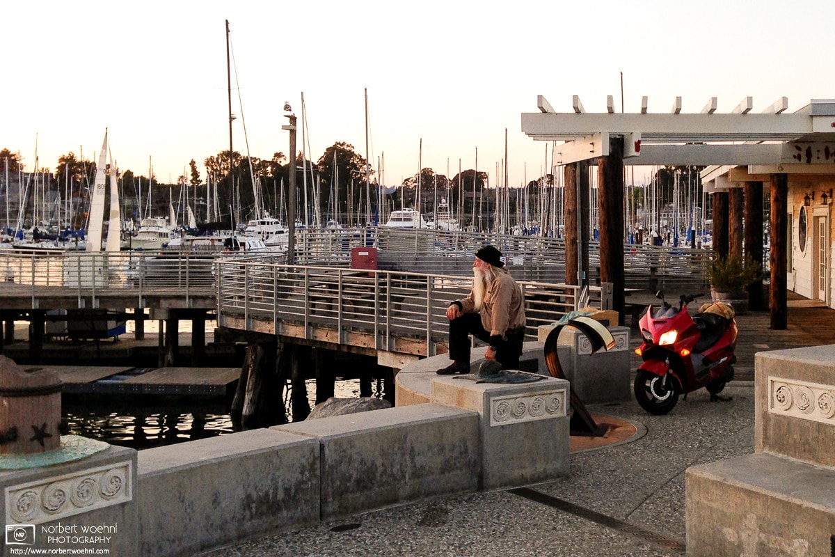 A biker enjoying the sunset at the Santa Cruz Small Craft Harbor in Santa Cruz, CA.
