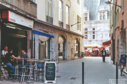 Afternoon scene from a side street in the historic city center of Grenoble, France.
