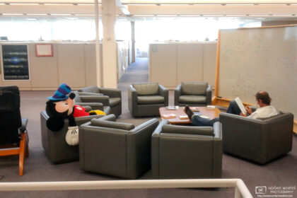 An exhausted Mickey Mouse is getting some rest at a sitting area inside a corporate office in Palo Alto, California.