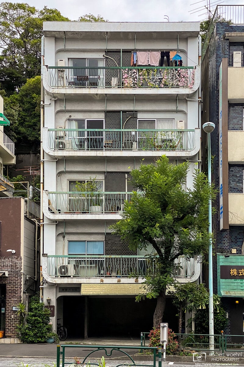 A colorful balcony on the upper floor of this apartment building in the Azabu-jūban area of Tokyo, Japan.