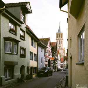 View along a line of old houses towards Kapellenkirche, one of the churches in Rottweil, Germany.