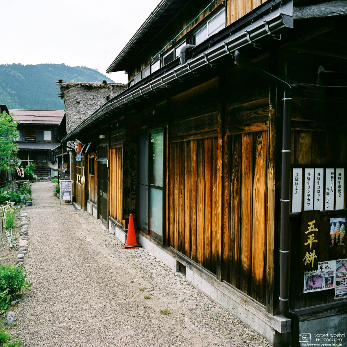 View along a line of eateries in the historic Ogimachi Village of Shirakawago in Gifu Prefecture, Japan.