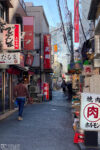 View along a lane of pubs and restaurants in the Kameido area of Koto Ward in Tokyo, Japan.